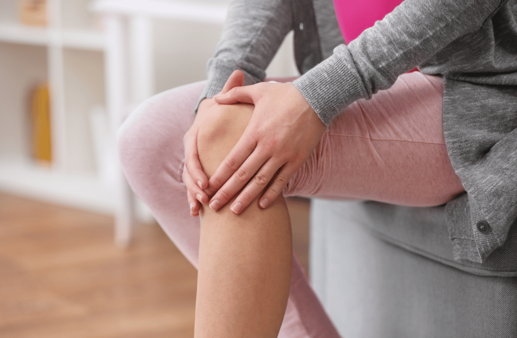 Woman Suffering With Knee Arthritis