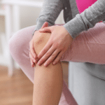 Woman Suffering With Knee Arthritis